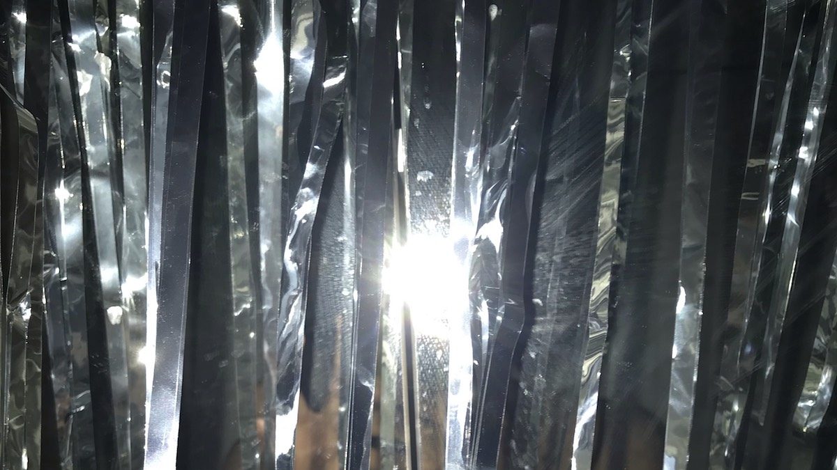 A bright flash on top of mylar ribbons.