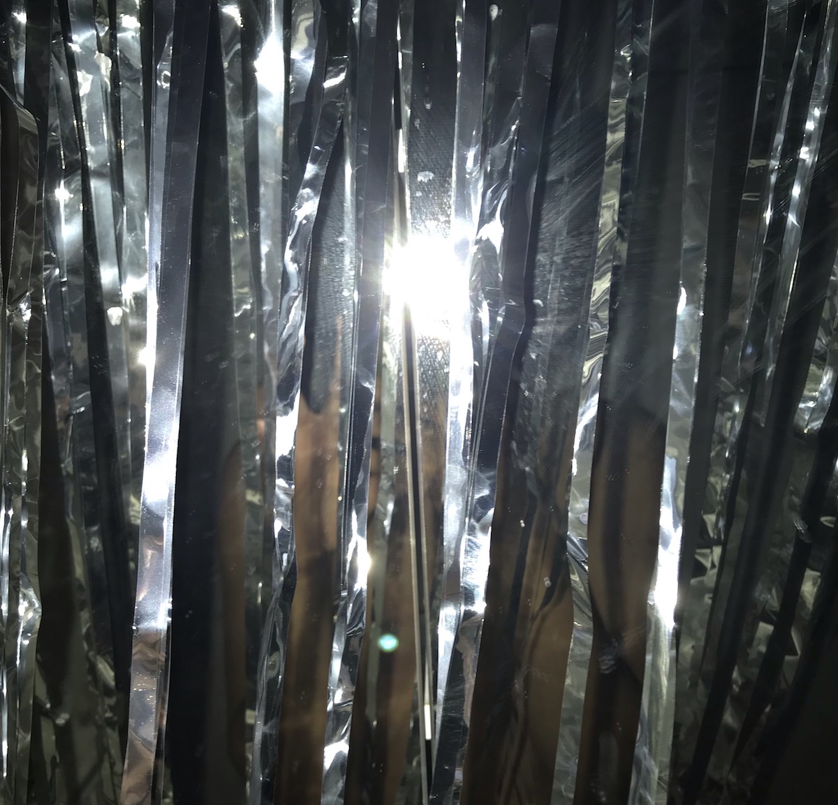 A bright flash on top of mylar ribbons.