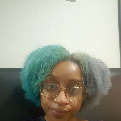 Destiny Harrison looking at the camera.