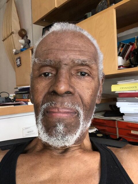 Elder Black man looking at the camera.