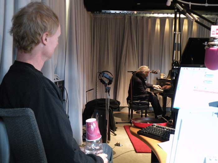 John Schaefer watches as the late New Orleans pianist/songwriter Allen Toussaint plays live in the WNYC studio.